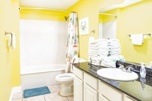 Bathtub, hair dryer, towels, soap