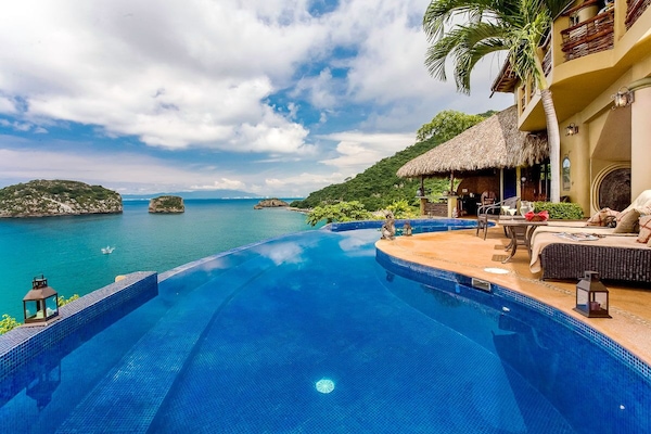 Infinity pool with views of Los Arcos