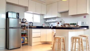Fridge, microwave, stovetop, coffee/tea maker