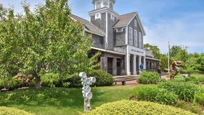 A historic building with a prominent tower and a sign reading "Cape Cod Museum of Art". - Amazing Backyard, Spacious, Dog Friendly! (Dennis)