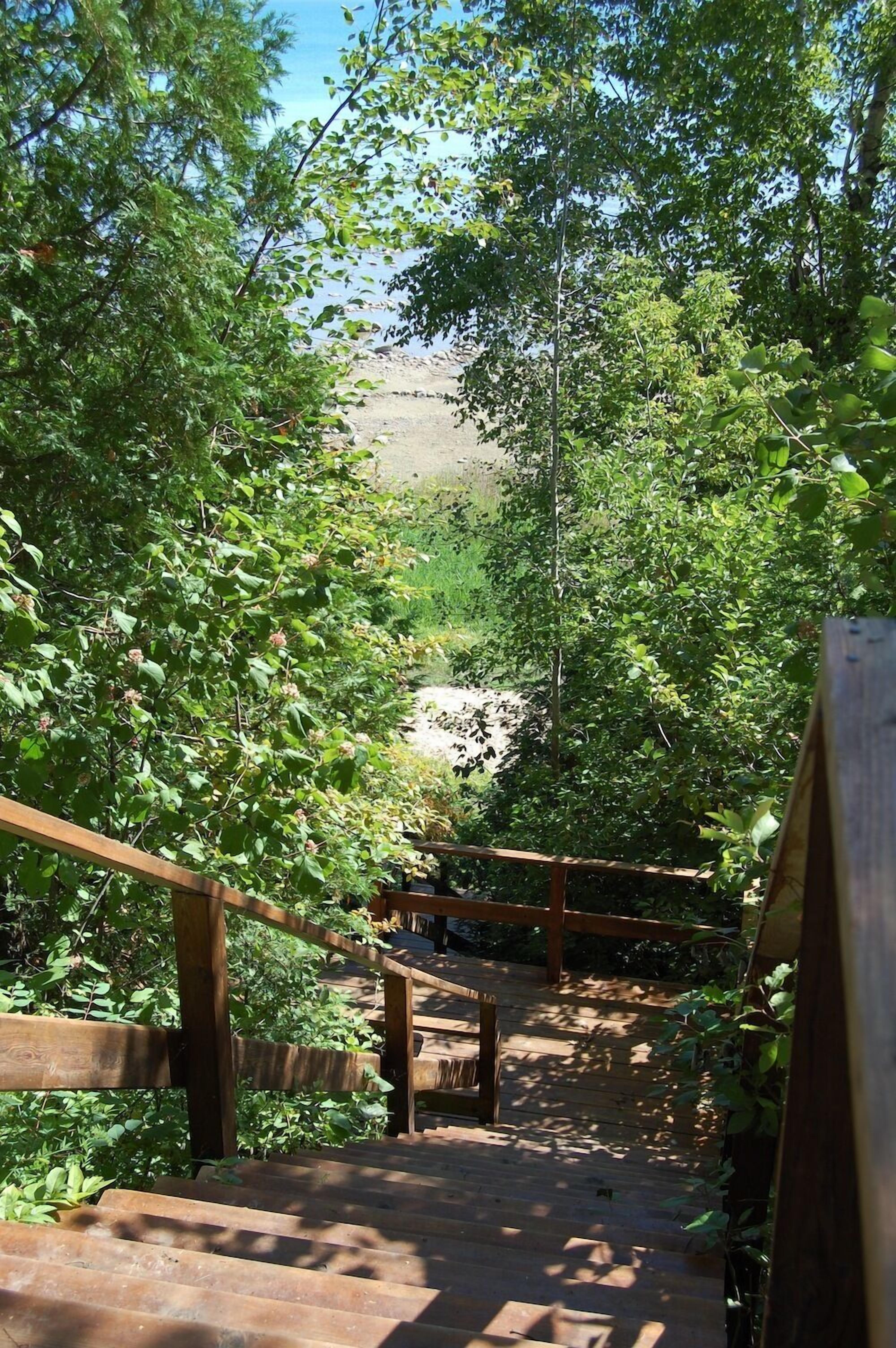 starting down the stairs to the lake