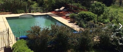 Outdoor pool, a heated pool, pool loungers
