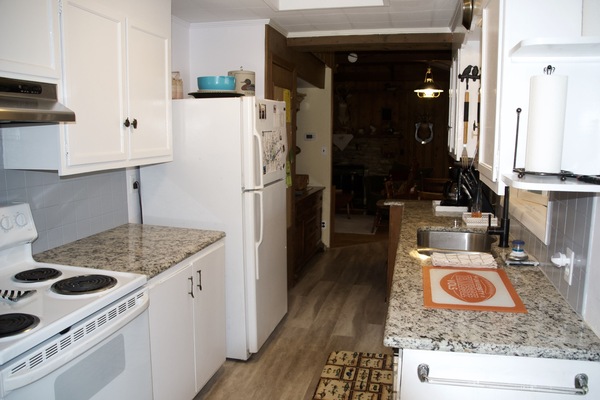 Kitchen looking toward den. There are new stainless appliances since this pix.