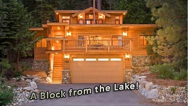 A large, two-story wooden cabin with a balcony, surrounded by trees. - Fabulous Cabin Block away from<br>Private Beach (Tahoe City)