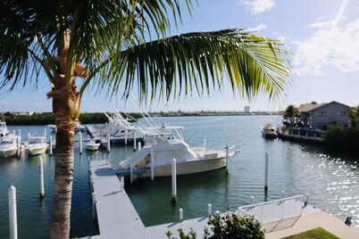 Finest location in Coral Lagoon.  End unit with bay views and boat slip! 