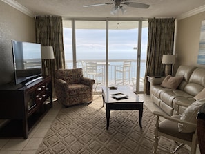 View of the balcony and ocean from the kitchen.