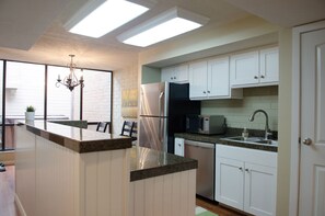 Kitchen with a view of private hot tub outside windows