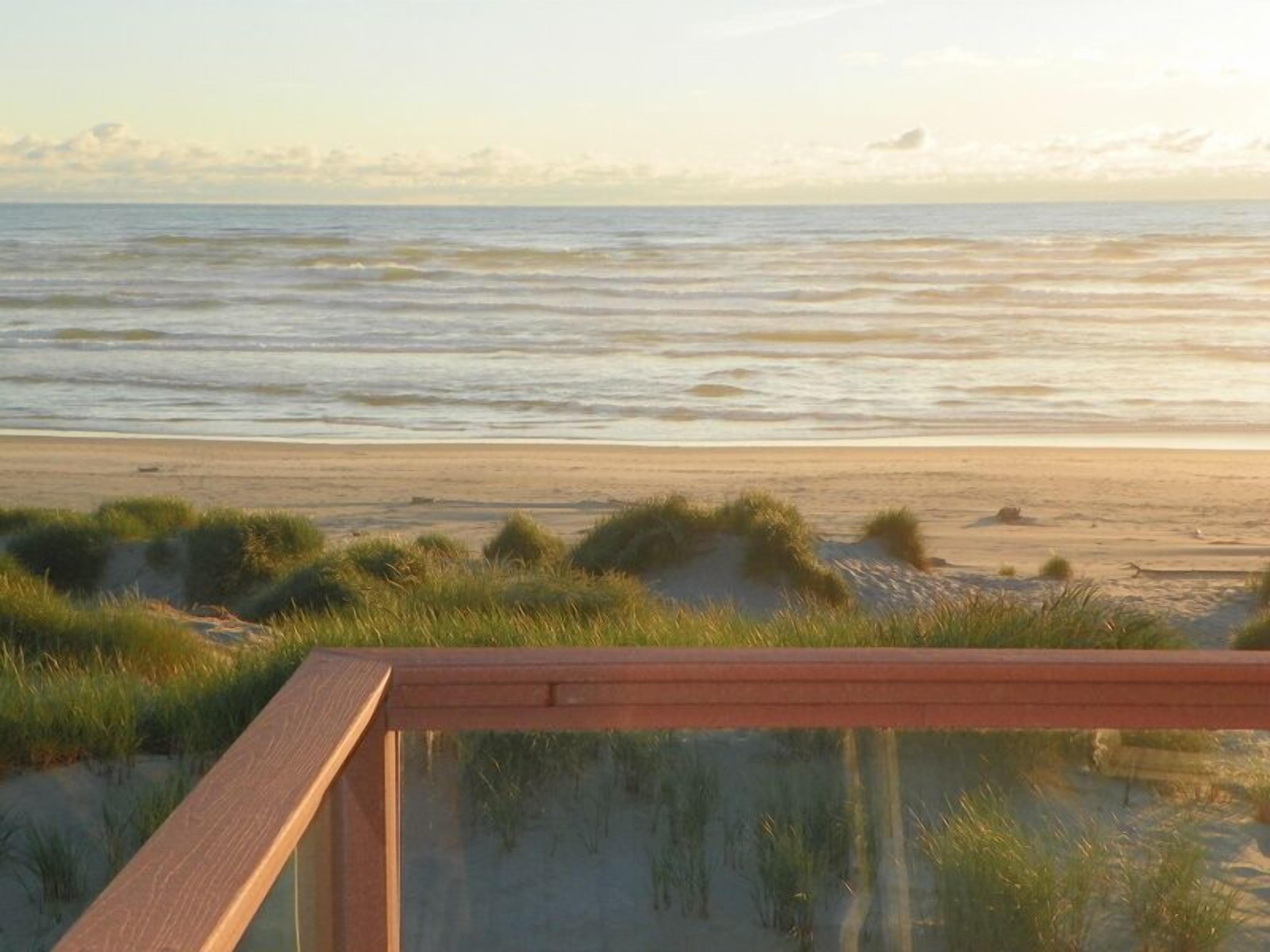 Upstairs Deck off living, dining and kitchen.  Great place to watch the sunsets!