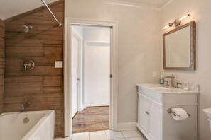 Combined shower/bathtub, hair dryer, towels, soap