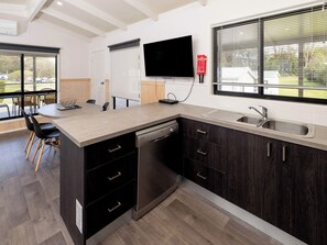 Superior Garden View 3 Bedroom Cabin | Private kitchen | Full-sized fridge, microwave, oven, stovetop - BIG4 Wallaga Lake Holiday Park (Wallaga Lake)