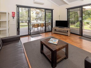 Deluxe 2 Bedroom House | Living area | 32-inch flat-screen TV with satellite channels - BIG4 Wallaga Lake Holiday Park (Wallaga Lake)