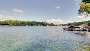 A lake with a dock and a boat named "JETSKI" on it. - Laconia Home w/ Beach - 1/2 Mi to Weirs Beach (Laconia)