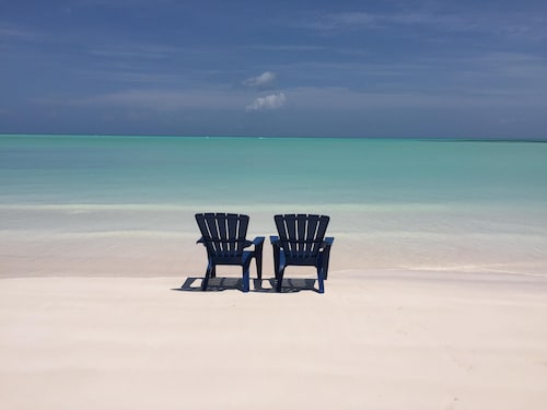 Step from your porch onto the soft white sand & crystal clear water.