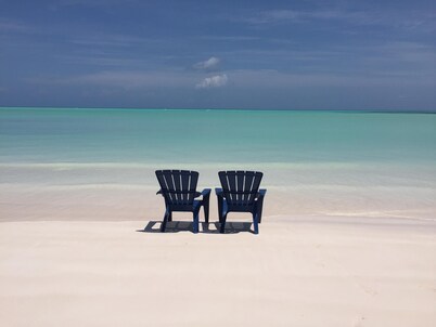 Step from your porch onto the soft white sand & crystal clear water.