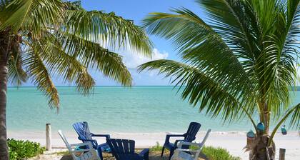 Step from your porch onto the soft white sand & crystal clear water.