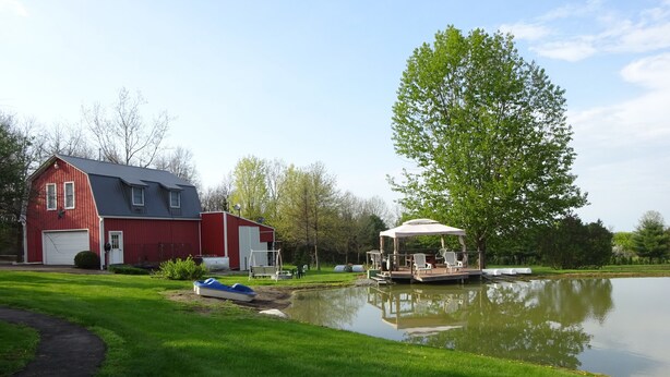 A red barn, a pond with a dock, and a gazebo. - Rest and relax- great view of Hemlock hills and surrounding area. (Hemlock)