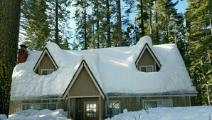 A cabin with a snow-covered roof and two dormer windows, surrounded by tall pine trees. - PinecrestAreaRentals #10 Getaway Fall/labor day 3rd night free just Book 2nights (Strawberry)