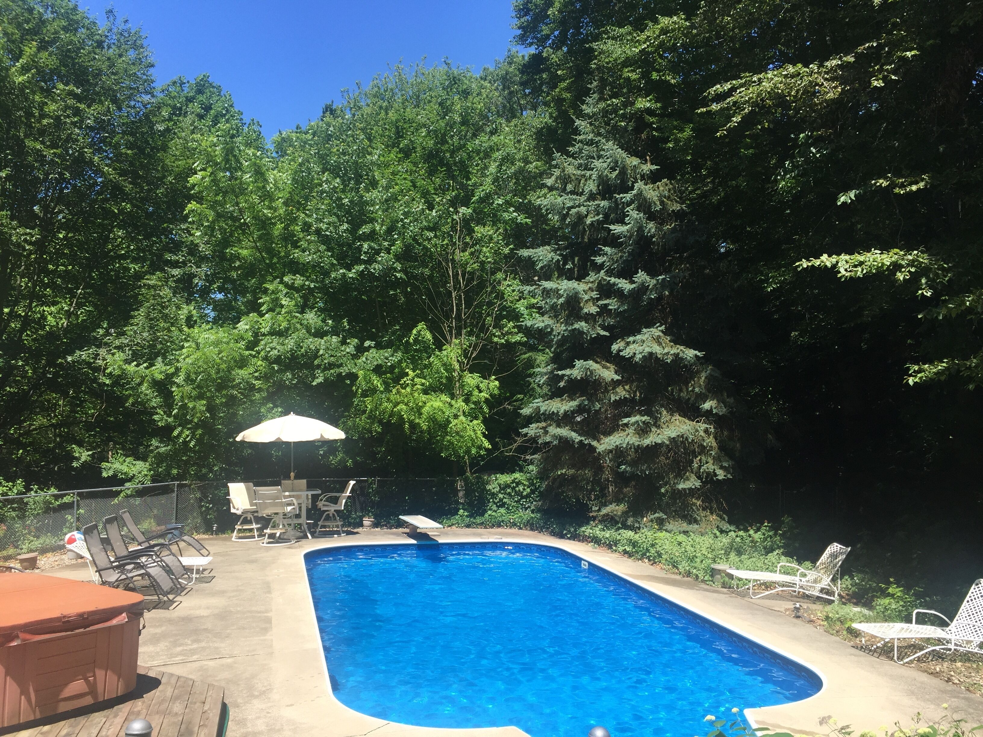 Large family home with private POOL and hot tub on heavily wooded lot