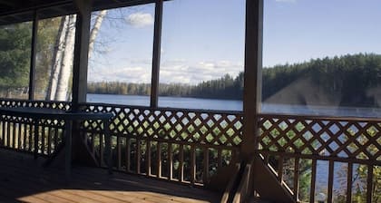 SECLUDED LODGE WITH ONE OF THE LARGEST PRIVATE STOCKED LAKES IN MICHIGAN.