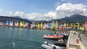 A marina with multiple sailboats docked, a wooden pier, and mountains in the background. - Apartment/ flat - Pietra Ligure (Pietra Ligure)