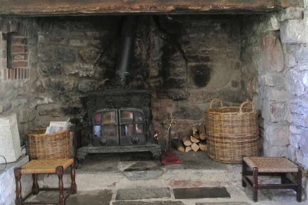 The large inglenook fireplace with Esse Dragon wood burning stove.