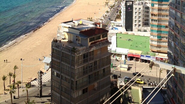 A coastal cityscape with a beach, high-rise buildings, and a clear sky. - Levante beachfront vacation with spectacular views and sunny terrace (Benidorm)