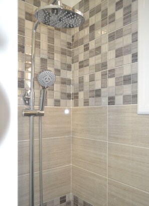Bathtub, hair dryer, towels, soap