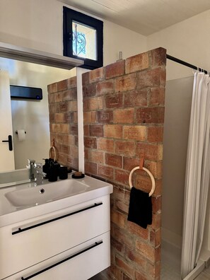 Shower, hair dryer, towels, toilet paper