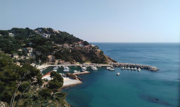 Enjoy a serene setting with a marina and sea views from this hillside property.