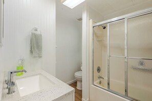 Bathtub, hair dryer, towels, soap