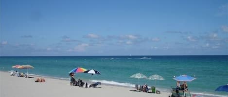 On the beach, sun-loungers, beach towels