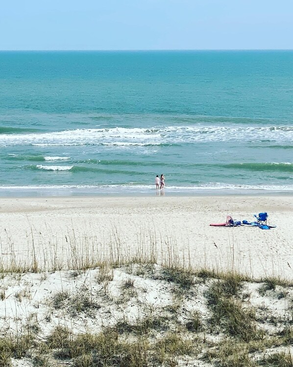 On the beach, sun-loungers
