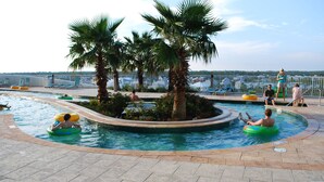 A pool area with multiple water slides and palm trees. - YaaHooo!!!!! Blue Velvet / Turquoise Place / FABULOUS !!!!!!!!! (Orange Beach)