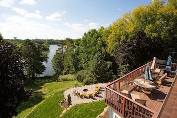 Perched high above Lake Schmidt, this home offers sweeping lake views from the spacious deck and the immaculate fire-pit patio.