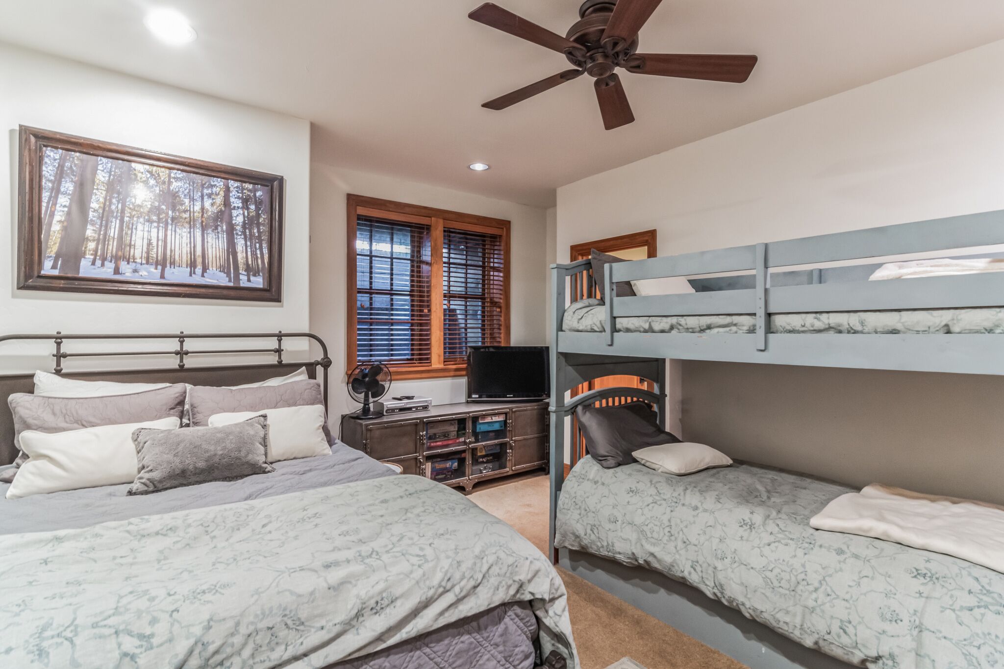 Basement guest bedroom 4 with Queen bed, bunk beds, and smart TV (en-suite bath)