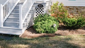 A cottage with a front porch, a blue door, and a 'COTTAGE' sign. - Relax in the beautiful South River Valley just minutes from wineries,  (Stanardsville)