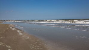 A beach with a sandy shore and waves. - Inlet Cove Paradise #36 (Kiawah Island)