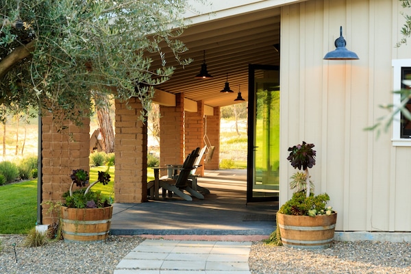 Front porch with swing. Views of mountains and rolling hills.