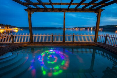 8500 sf, Sleeps 48 in beds, Pool, Hot Tub, Game Rm, 300 ft lake front, In town