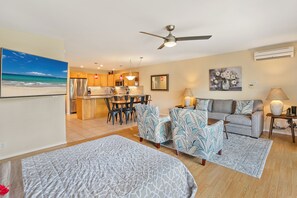 Relax in this well-appointed living space with a comfortable sofa, dining table, and kitchen area.