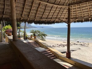 On the beach, sun-loungers, beach towels - Oceanfront Condo On The Beach With Panoramic Views (Puerto Vallarta)