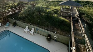 A pool area with a view of the beach and ocean. - OCEAN FRONT with POOL, Great LOCATION near pier, 5 bed & 5 bath (Ocean Isle Beach)