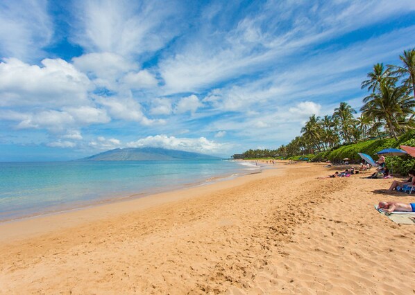 On the beach, sun-loungers, beach towels