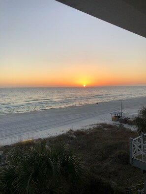 Guests can enjoy a serene beach experience with access to the ocean and a nearby lifeguard station.