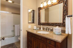 Bathtub, hair dryer, towels, soap