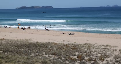 ONEMANA. Premium location. Walk across the road to the beach.