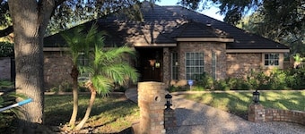 Private oasis in prime McAllen location with Gated Parking, Heated Pool & Spa