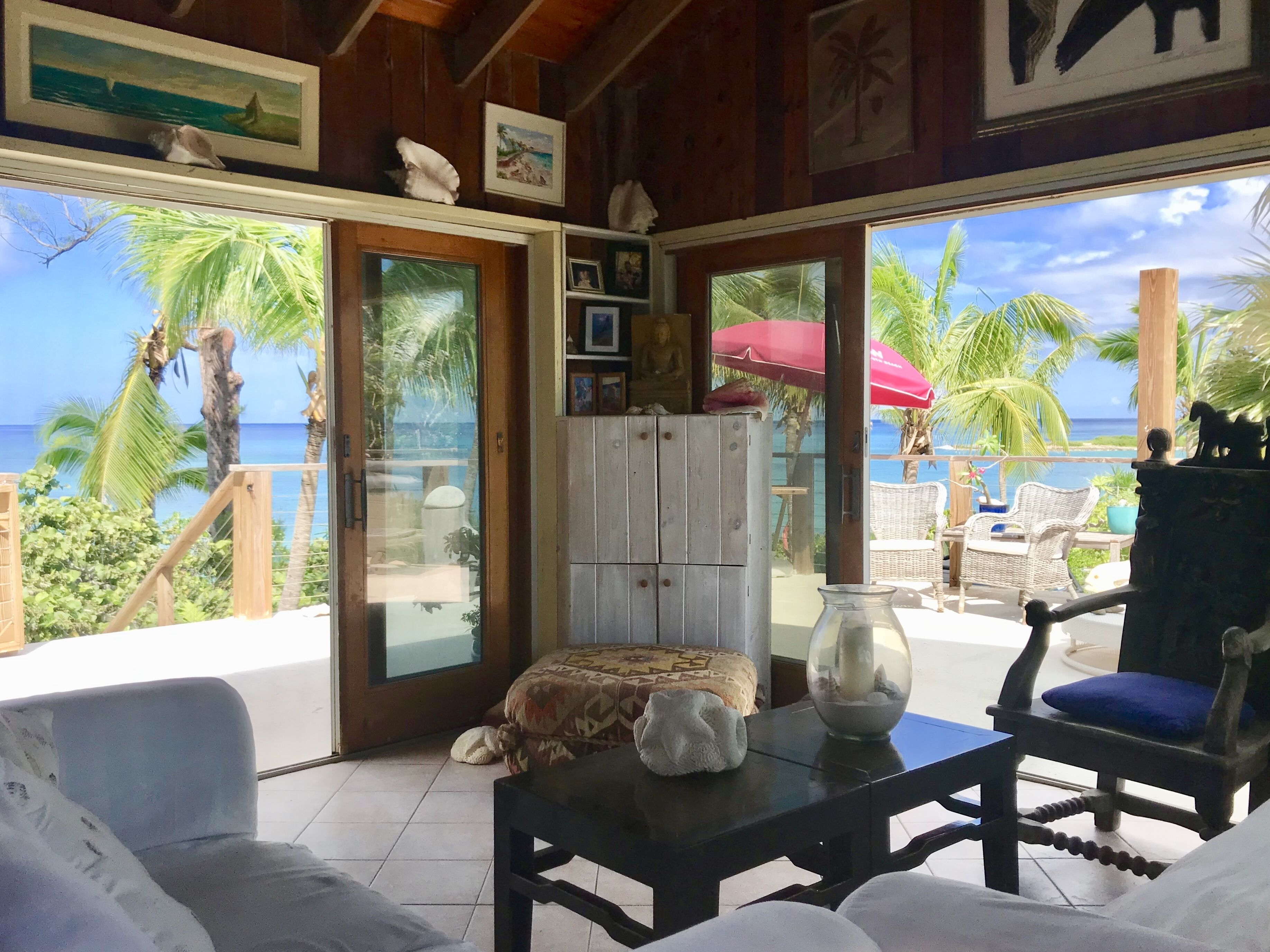 Living room and views to expansive deck and ocean. 