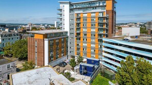 A multi-story building with a modern architectural design, featuring a mix of brick and glass facades. - Purbecks  - Superb views to Poole Harbour and Purbeck Hills (Poole)