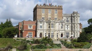 A large, historic building with multiple windows and a prominent tower. - Castle Lanes - Minutes from Poole Quay (Poole)